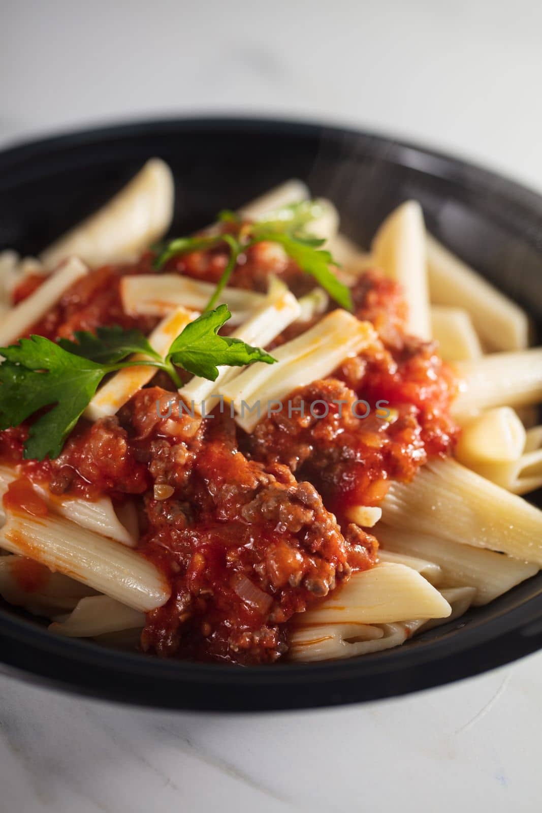Pasta Penne with Tomato Bolognese Sauce, Parmesan Cheese and Basil. by senkaya