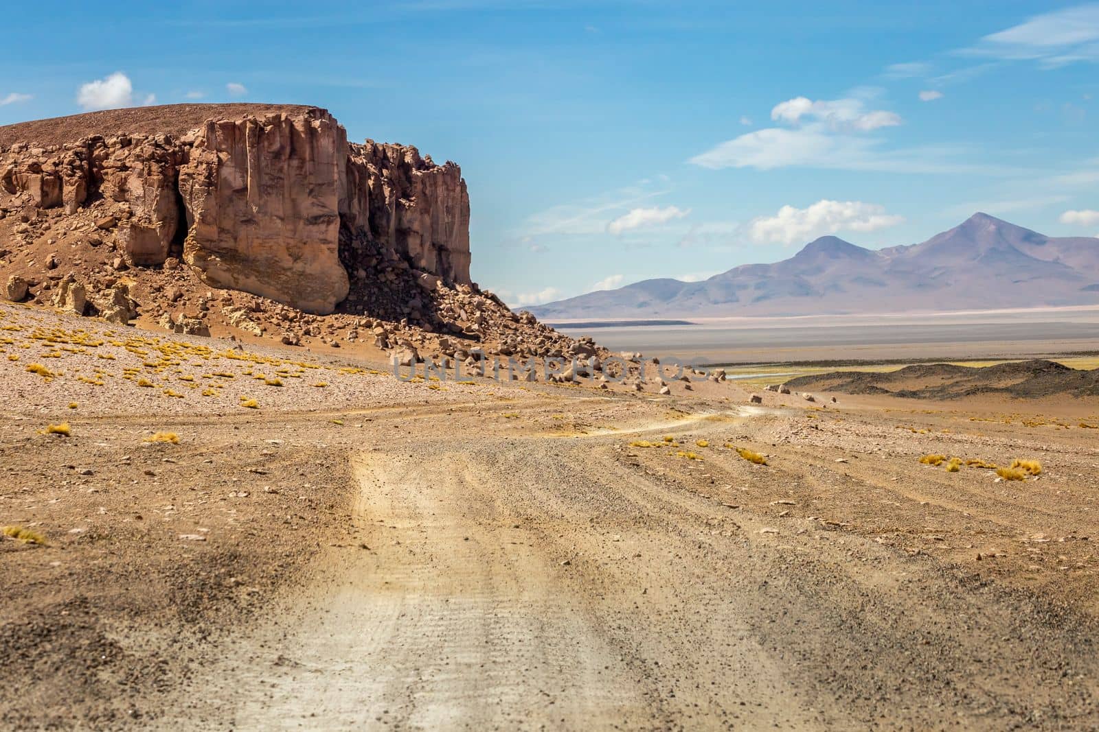 Dirt Road in Peaceful Moon Valley dramatic landscape at Sunset, Atacama Desert, Chile