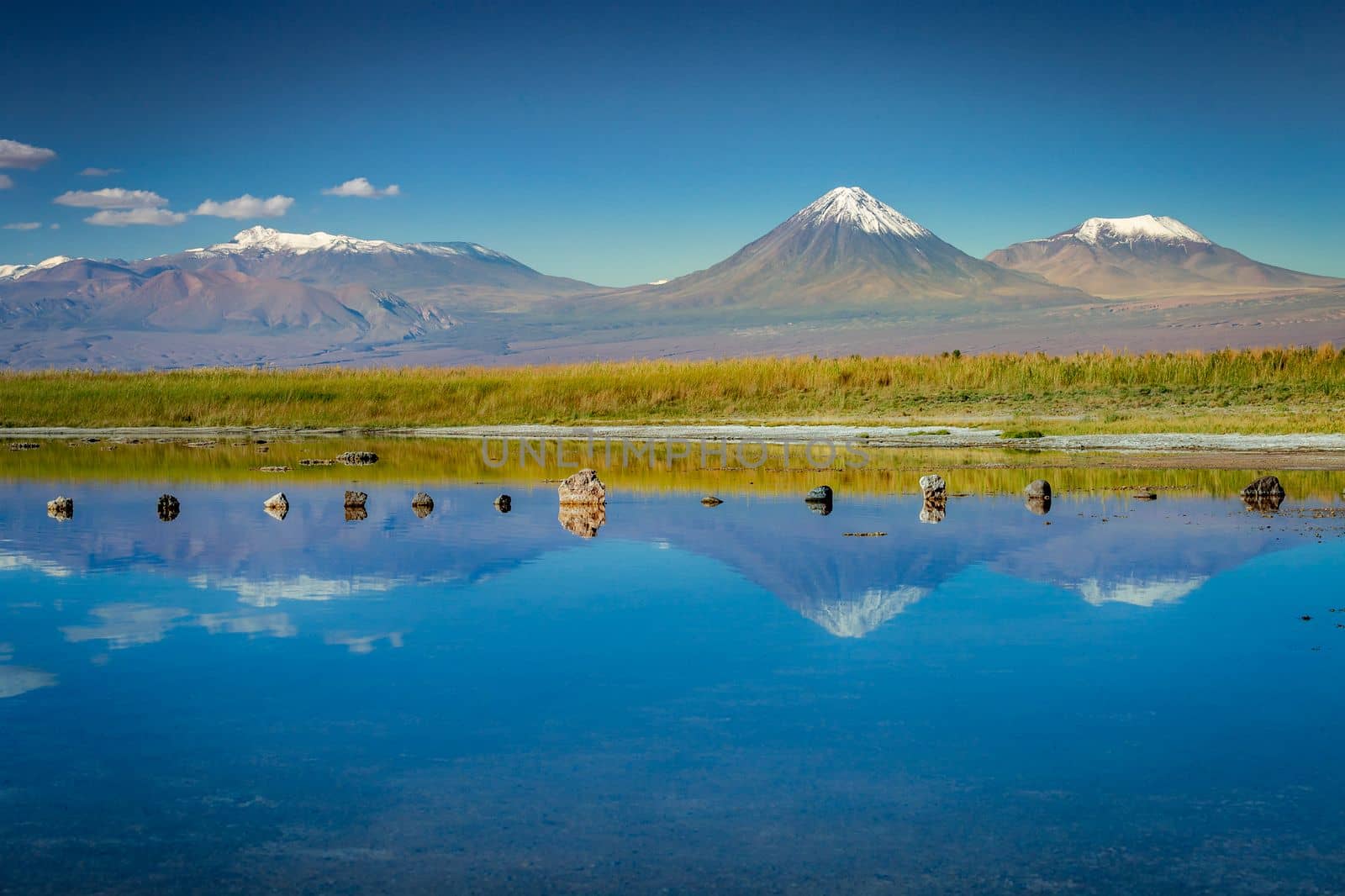 Licancabur and Peaceful reflection lake with dramatic volcanic landscape at Sunset, Atacama Desert, Chile