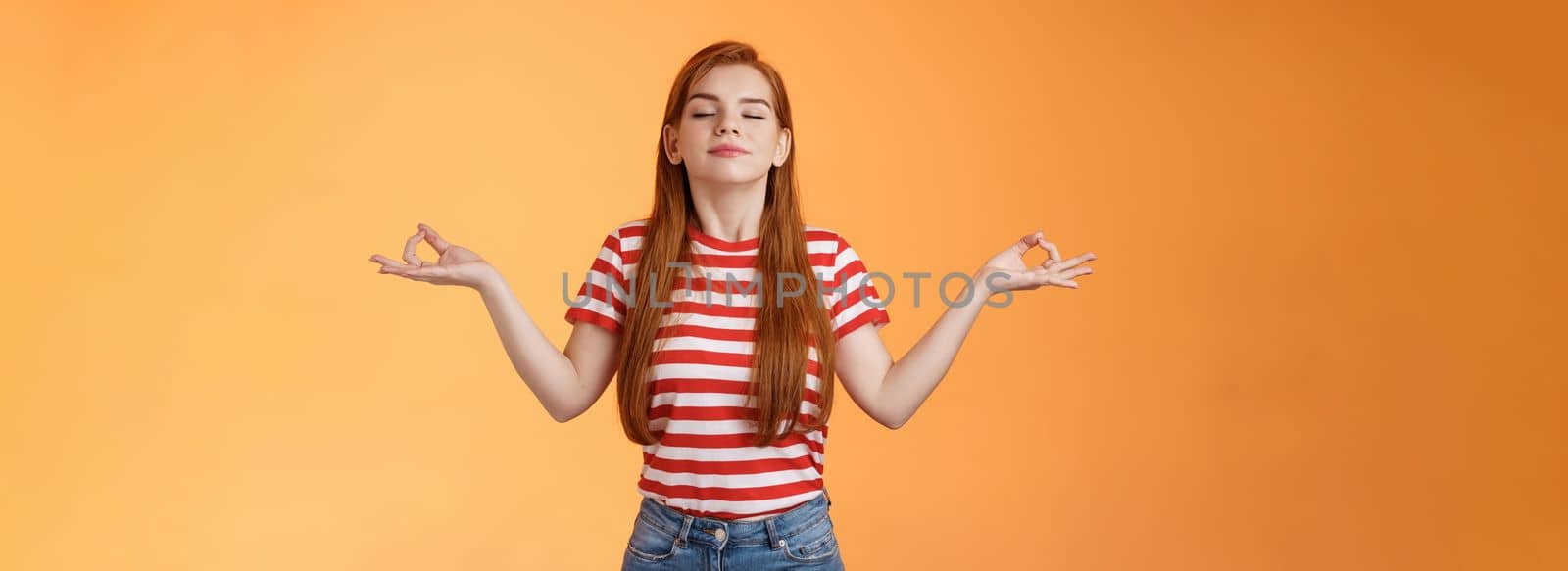 Girl listening relaxing podcast meditating indoors, breath fresh air, close eyes smiling peaceful delighted, stand orange background, chill carefree, enjoy practive yoga, relieve from stress by Benzoix