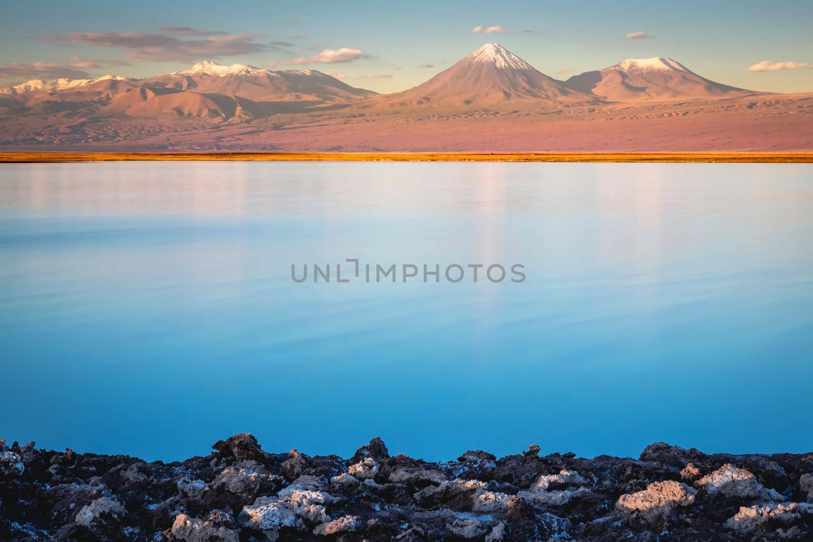 Licancabur and Peaceful reflection lake with dramatic volcanic landscape at Sunset, Atacama Desert, Chile