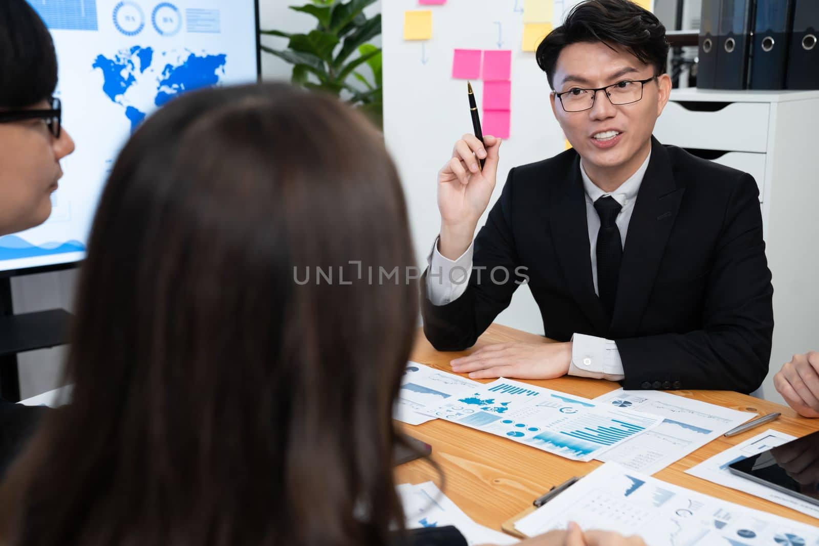 Business team of financial data analysis meeting with business intelligence, report paper and dashboard on laptop for marketing strategy. Business people working together to promote harmony in office.