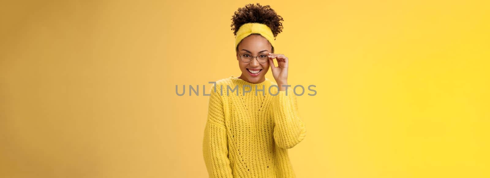 Attractive friendly charismatic female programmer frontend developer smiling broadly check glasses nose look confident lucky have excellent idea improve app workability, standing yellow background.