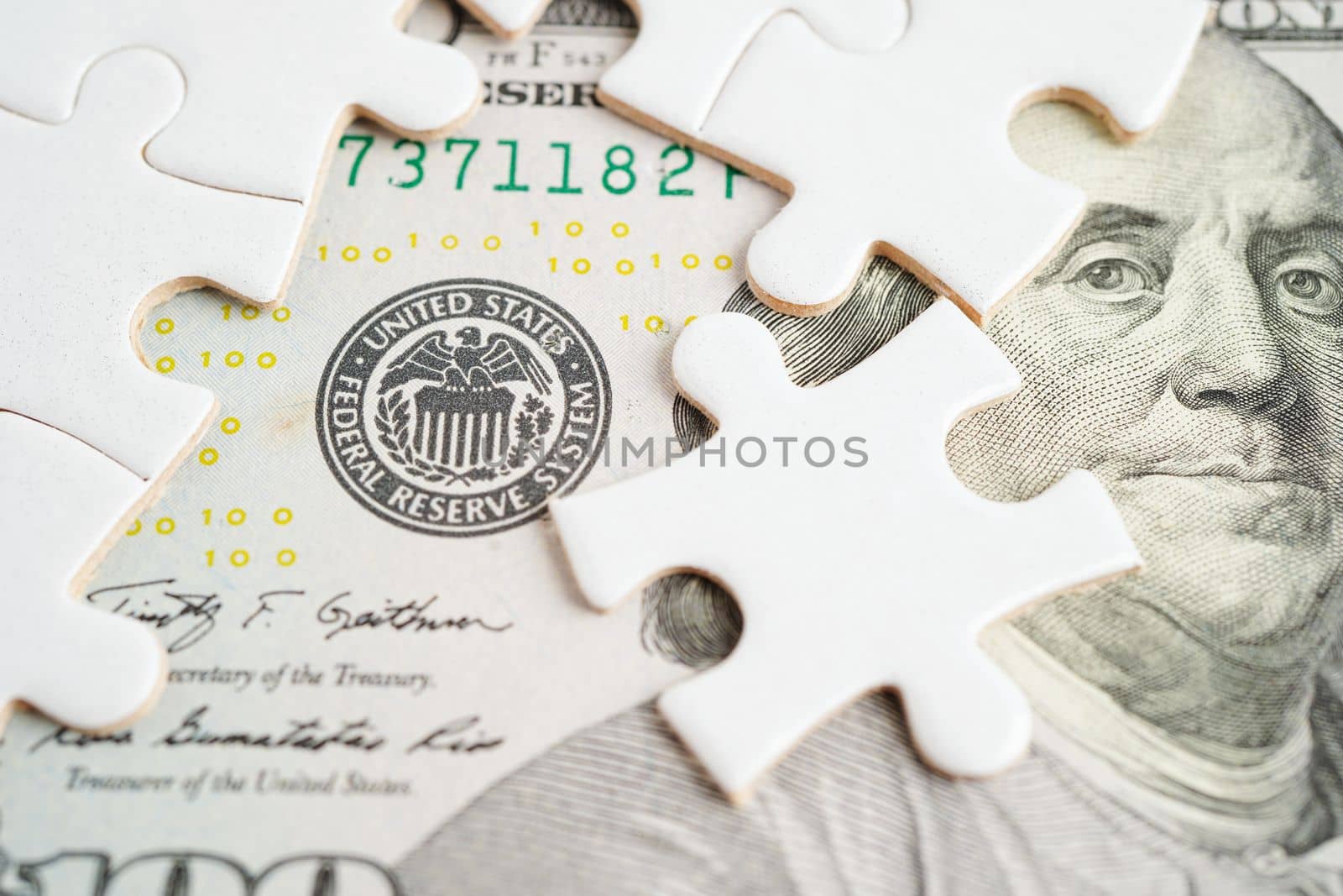 FED The Federal Reserve System with jigsaw puzzle paper, the central banking system of the United States of America. 