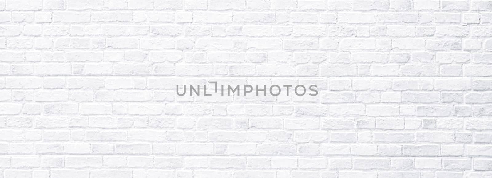 Brick wall, antique old grunge white texture wide panorama background.