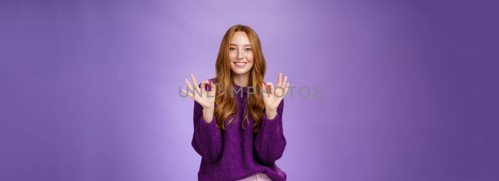 Girl loves her new haircut showing okay gesture with both hands and smiling delighted, feeling happy and satisfied, posing in purple outfit over violet background pleased with perfect customer service by Benzoix