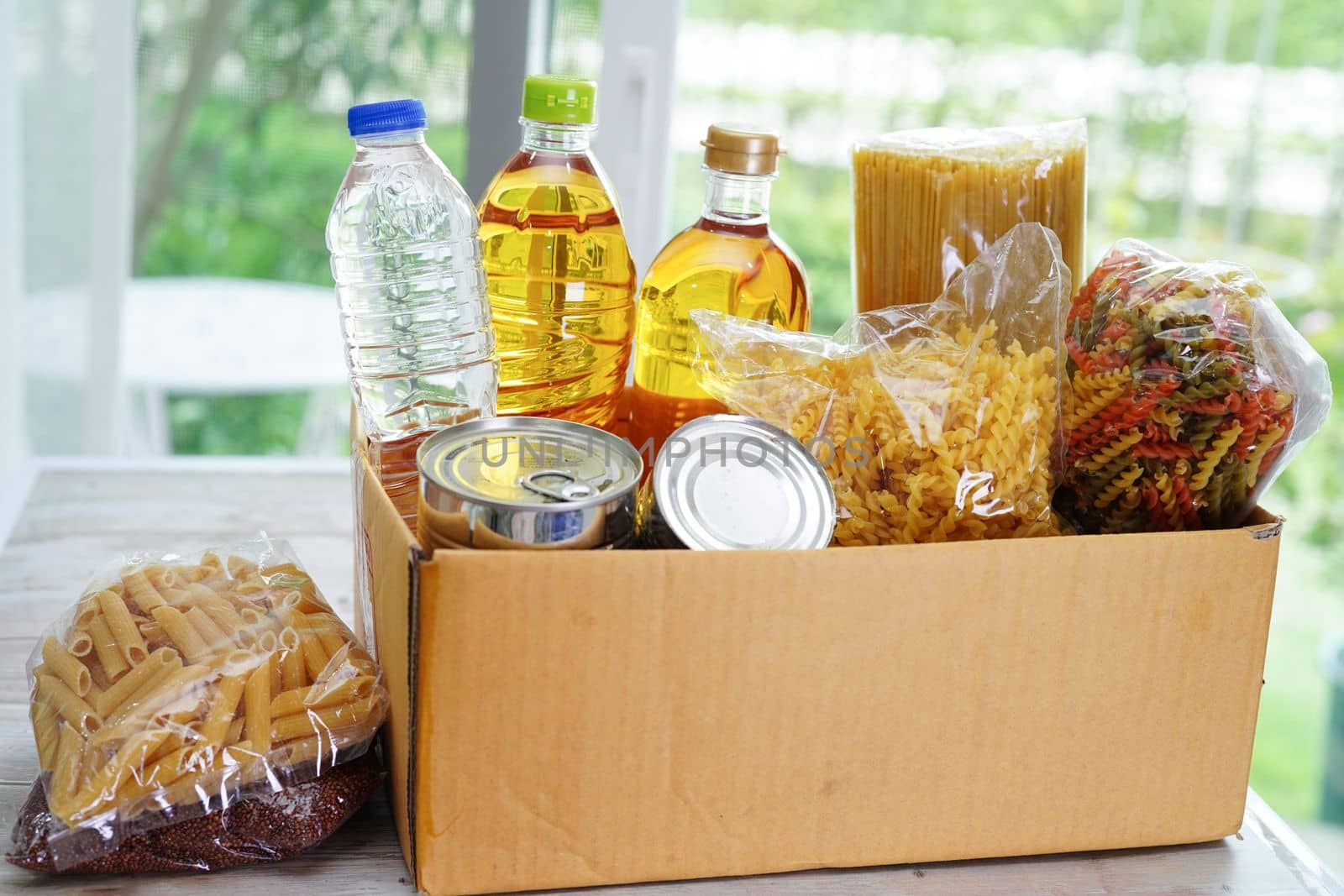 Foodstuffs in donation box for volunteer to help people.