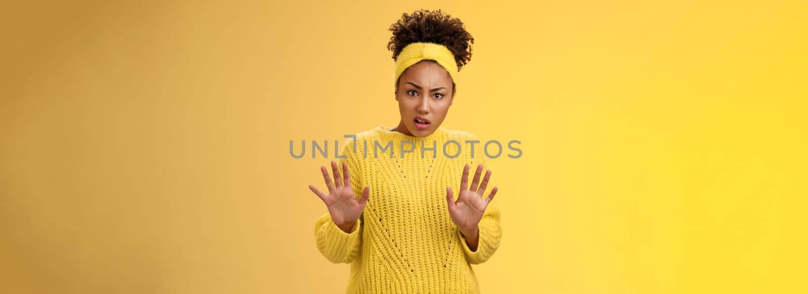 Arrogant ignorant disappointed reluctant fashionable popular african american girl university student reject awful offer raise hands stop enough refusal rejection gesture look shocked offended by Benzoix