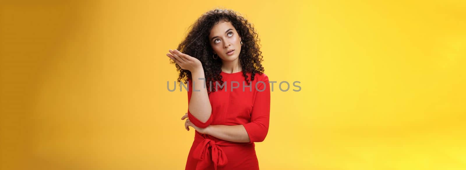 Girl being annoyed unwilling to listen boyfriend yell rolling eyes up from annoyance and irritation sighing bothered slapping forehead with palm fed up and disappointed over yellow background by Benzoix