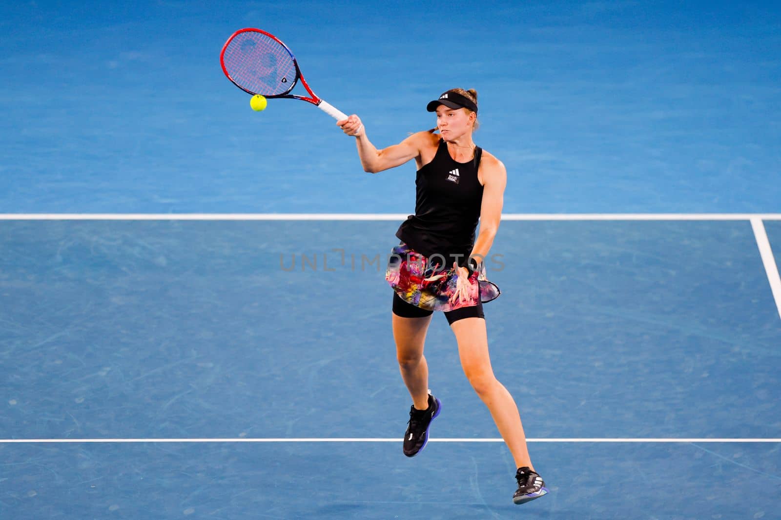 MELBOURNE, AUSTRALIA - JANUARY 24: Elena Rybakina of Russia plays Jelena Ostapenko of Latvia in quarter finals action on day 9 of the 2023 Australian Open at Melbourne Park on January 24, 2023 in Melbourne, Australia.
