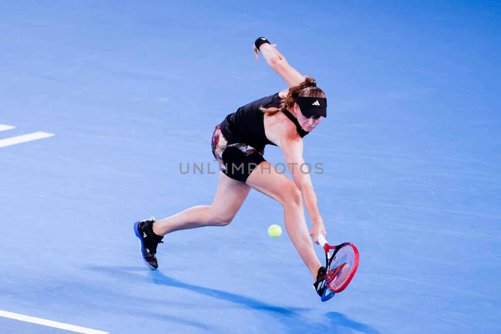 MELBOURNE, AUSTRALIA - JANUARY 24: Elena Rybakina of Russia plays Jelena Ostapenko of Latvia in quarter finals action on day 9 of the 2023 Australian Open at Melbourne Park on January 24, 2023 in Melbourne, Australia.