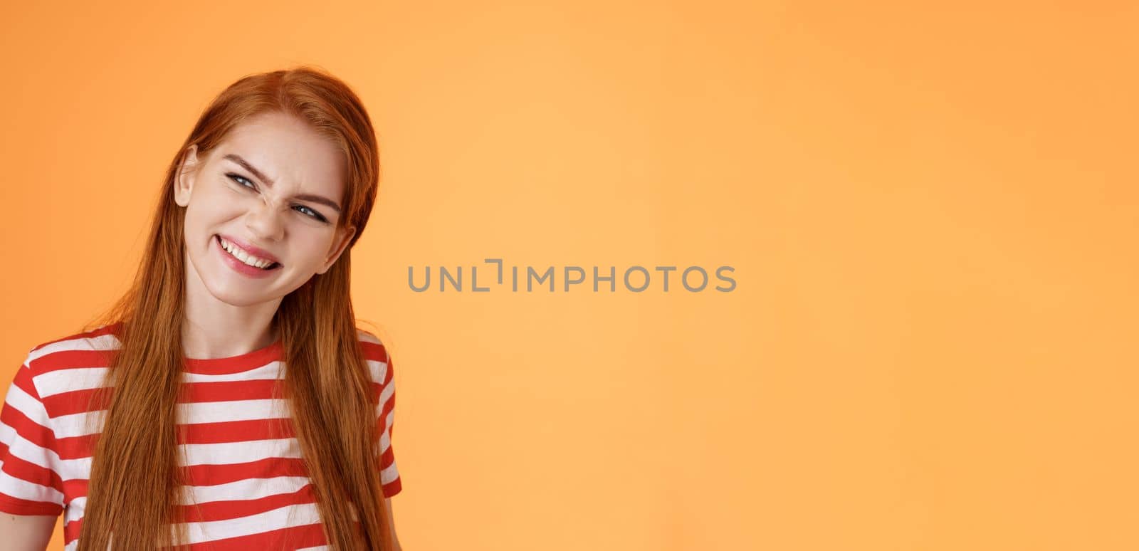 Sassy confident redhead daring girl have perfect summer plans, vacation ideas, inspired create something awesome, wrinkle nose excited, smiling satisfied look left assured, satisfied expression.
