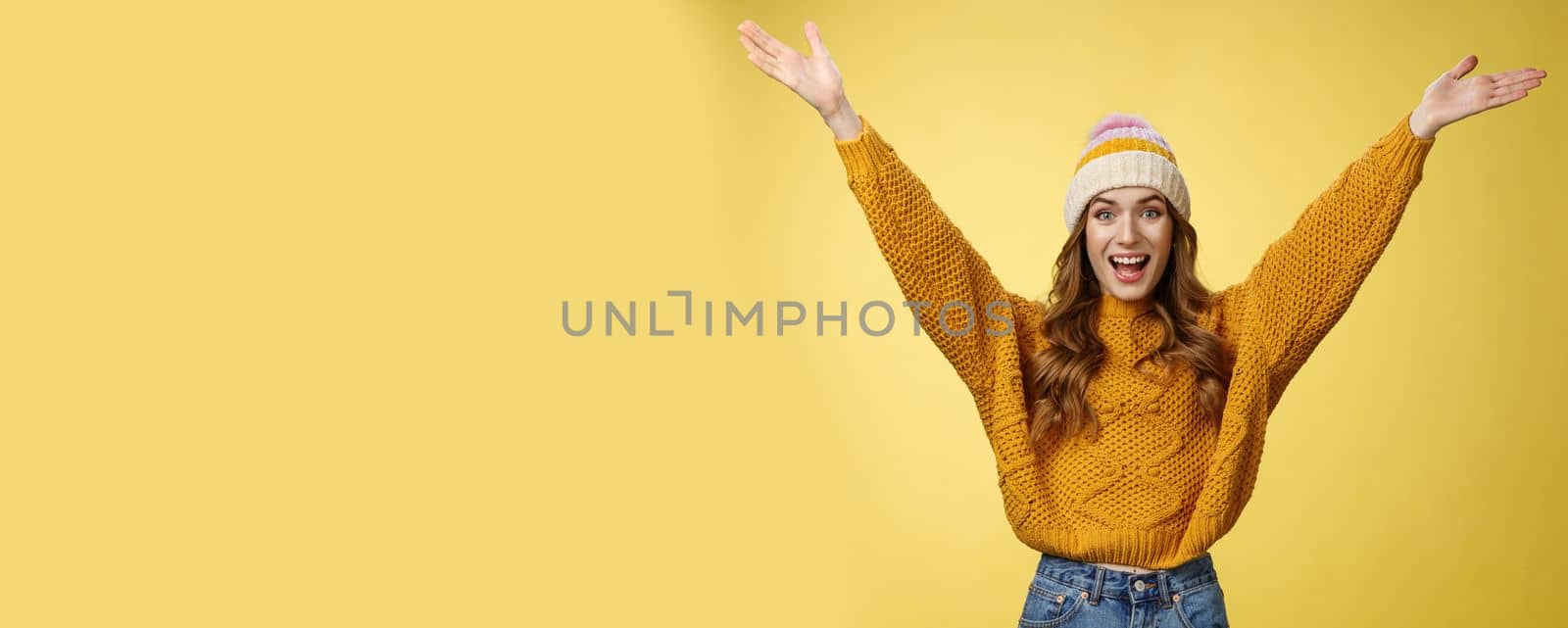 Hooray fantastic news. Portrait excited happy pleased charming young girl raising hands thrilled smiling broadly pleasant surprise meet best friend, celebrating achievement happily. Copy space