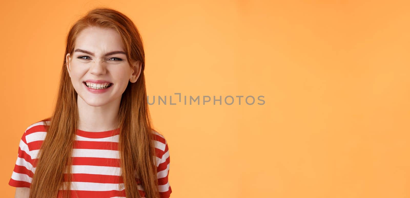 Close-up sassy good-looking cheerful redhead sly girl smiling toothy white perfect grin, satisfied dental clinic professional cleaning, standing orange background happy, joyful summer mood by Benzoix