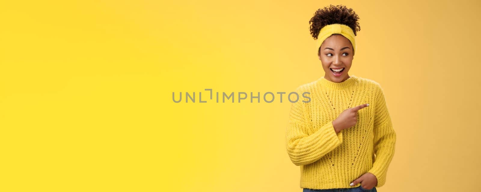 Astonished cute feminine modern african-american woman gossiping silly laughing drop jaw laughing surprised pointing right discuss during conversation interesting rumour place, yellow background by Benzoix