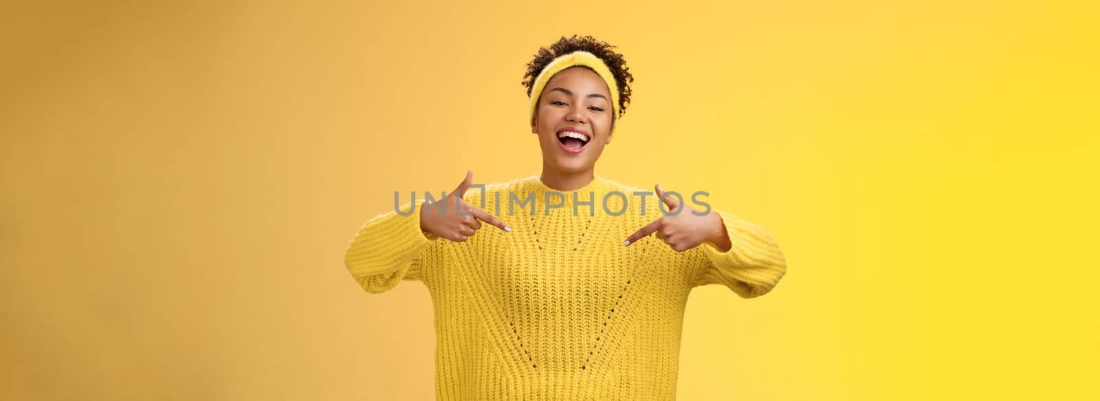 Confident good-looking outgoing black cute girl 20s in sweater headband afro hairstyle pointing heself raise head arrogant laughing bragging telling own personal goals achievements, suggest herself by Benzoix