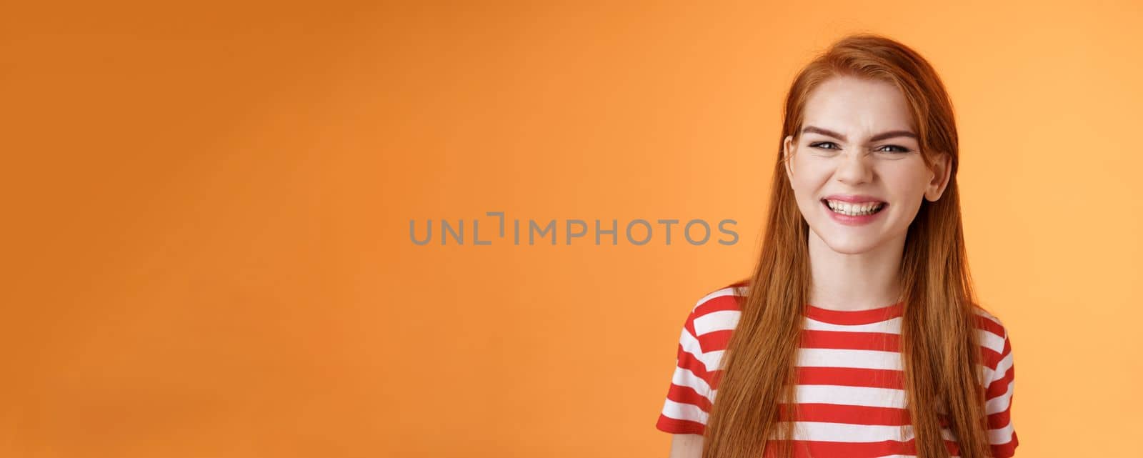 Close-up sassy good-looking cheerful redhead sly girl smiling toothy white perfect grin, satisfied dental clinic professional cleaning, standing orange background happy, joyful summer mood by Benzoix