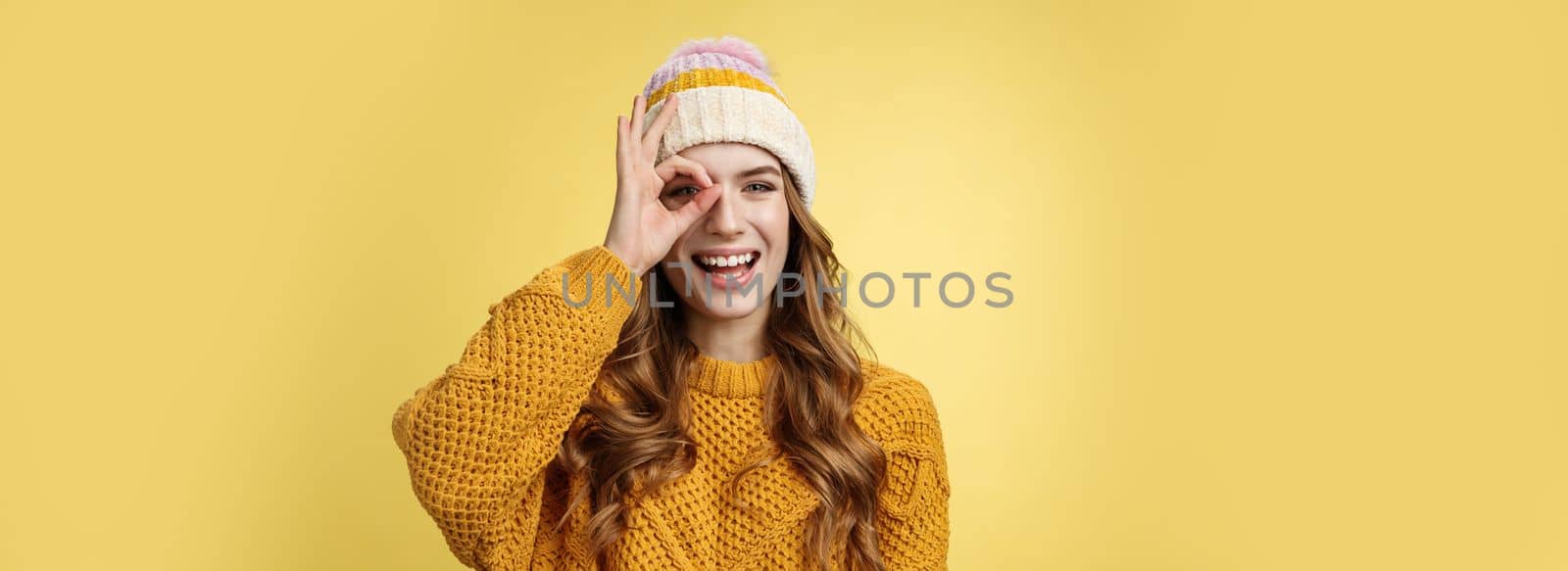 Carefree playful charismatic charming caucasian woman winter vacation having fun show okay ok gesture look through circle happily laughing smiling broadly white teeth, enjoying travel mountrains by Benzoix