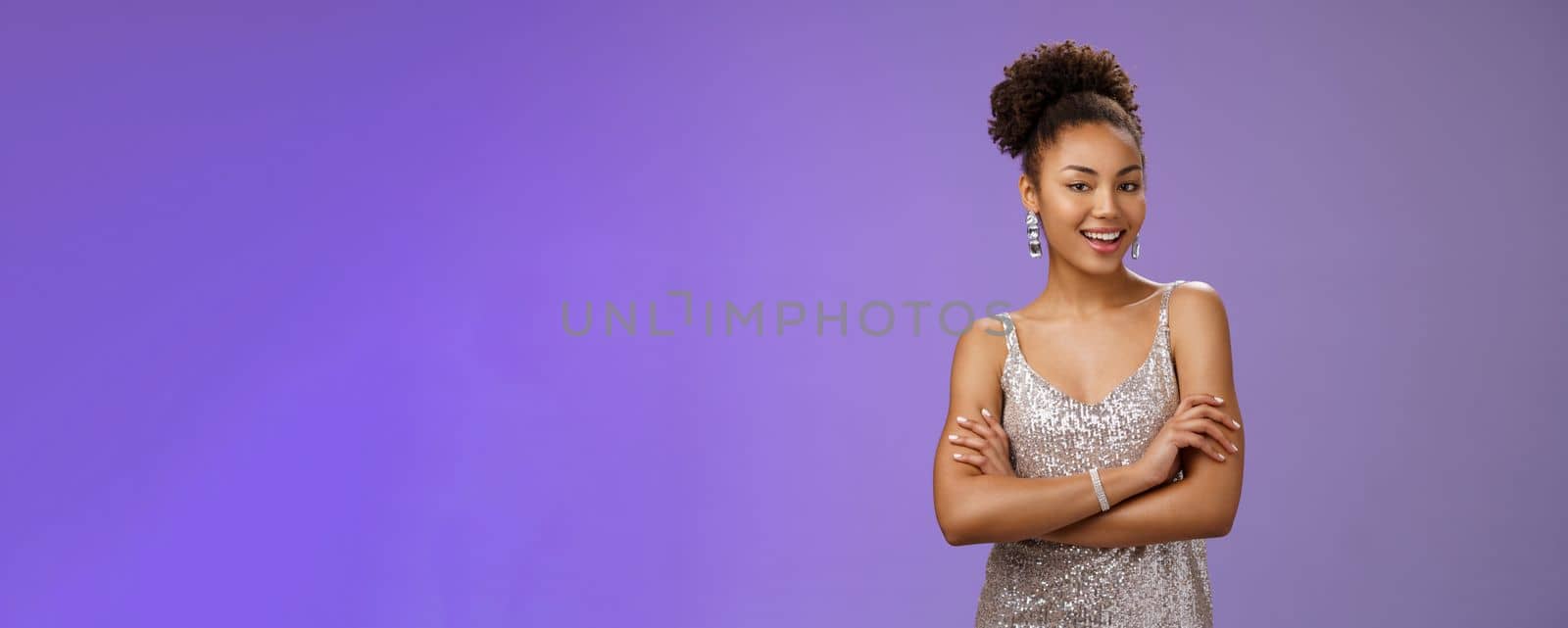 Stylish lucky happy attractive african-american female in glittering silver night-dress cross arms chest self-assured arrogant smiling delighted rejoicing nice interesting evening, satisfied.