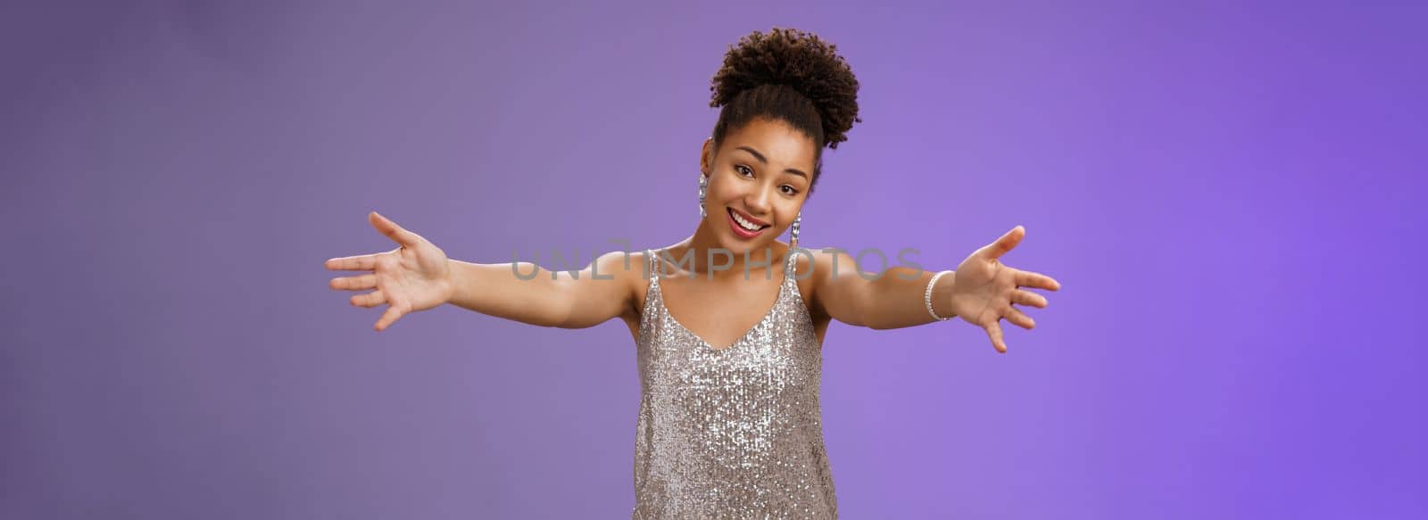 Lovely touched african-american female. in evening slver dress extend arms hug give cuddle tilt head smiling friendly wanna ebrace friend gladly standing blue background heartwarming welcome.