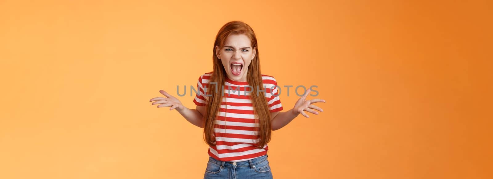Pissed angry and annoyed redhead female arguing yelling with hatred and anger, spread hands sideways dismay, complain look disappointed upset and hateful, stand orange background by Benzoix