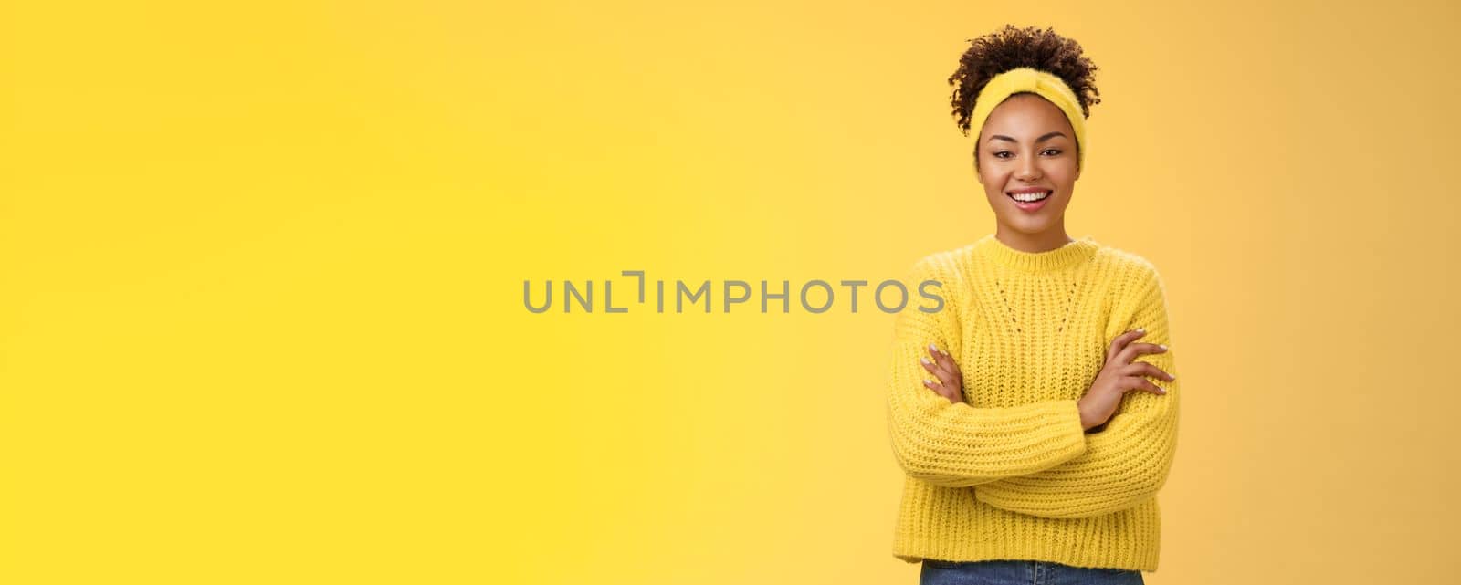 Serious powerful good-looking smiling african-american female femenist blogger cross hands chest confident pose grinning delighted enjoying watching working process, standing yellow background by Benzoix