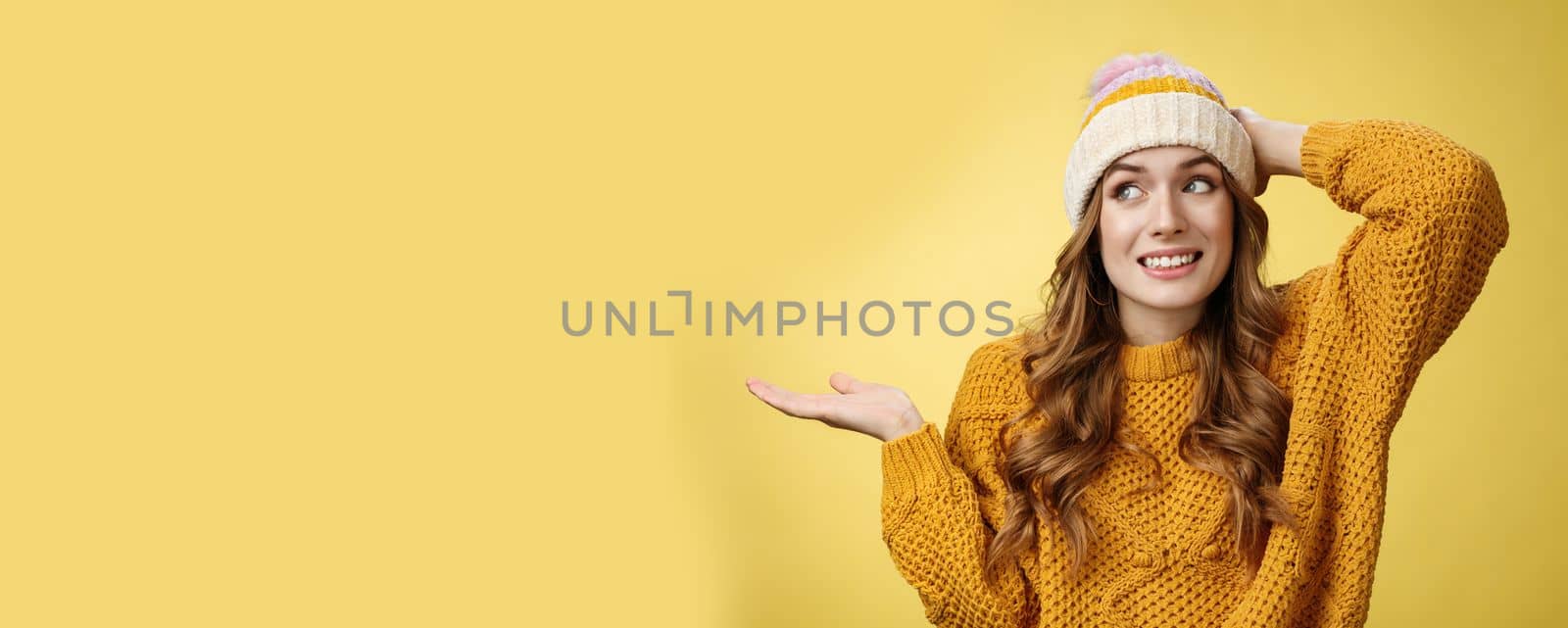 Oopsie sorry. Silly carefree charming flirty woman apologizing making foolish mistake grinning awkward scratch head shrugging hand put sideways, trying not look eyes, standing yellow background by Benzoix