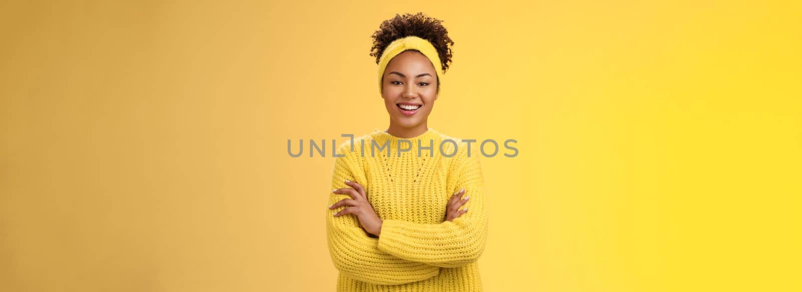 Serious powerful good-looking smiling african-american female femenist blogger cross hands chest confident pose grinning delighted enjoying watching working process, standing yellow background by Benzoix