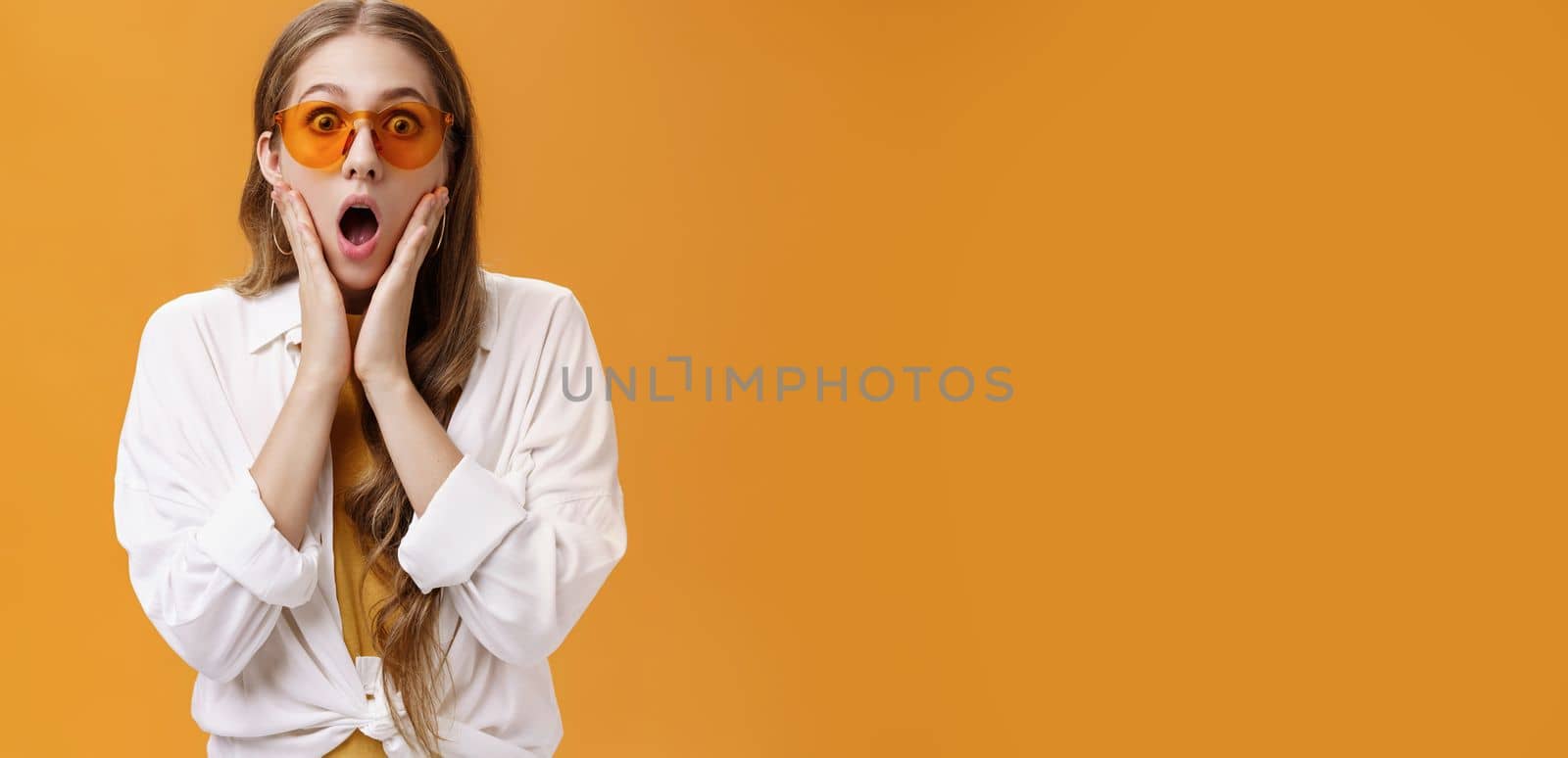 Waist Up Shot Of Amazed And Surprised Party Girl In Trendy Sunglasses