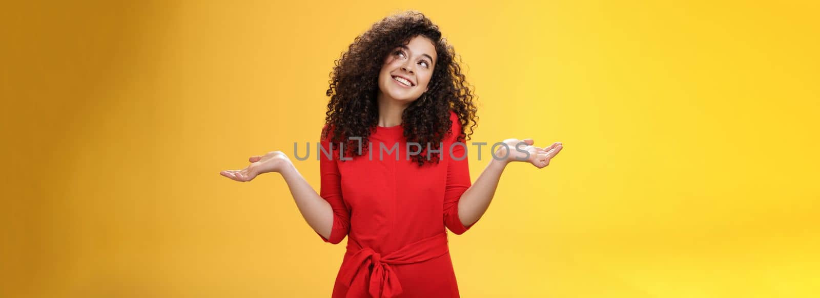 Girl feeling clueless and silly, being unbothered with anything, shrugging dreamy and indifferent, smiling carefree as looking dreamy at upper right corner, spread hands sideways in uncertain gesture by Benzoix
