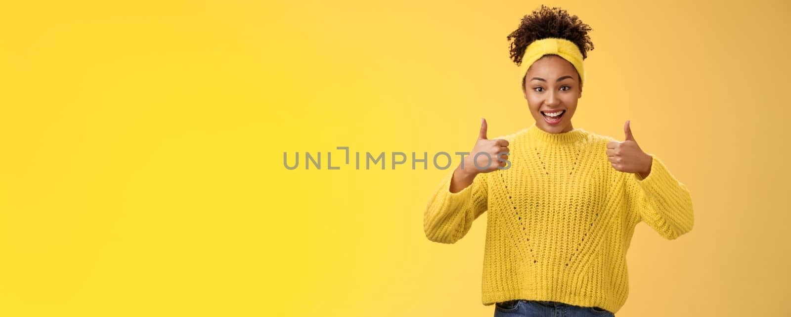 Supportive friendly modern trendy african-american female friend supporting you show thumbs-up keep up good work gesture proud doing best effort, liking result approving plan, yellow background by Benzoix