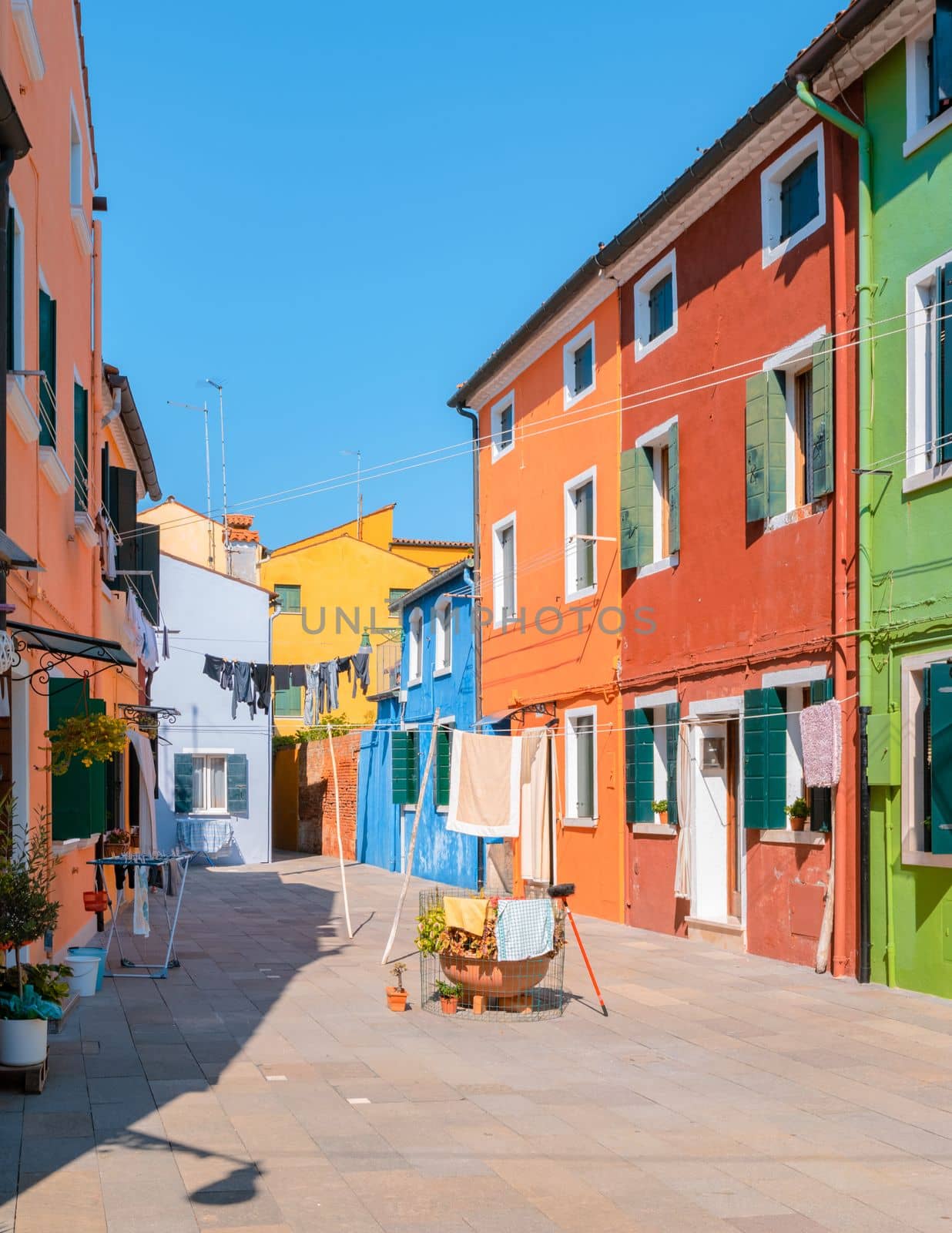 colorful streets of the village Burano Venice Italy colorful canal whit boats and vibrant houses. 