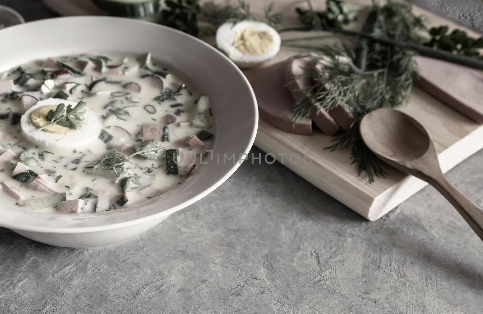Cold summer soup: okroshka with vegetables, herbs and kefir by georgina198