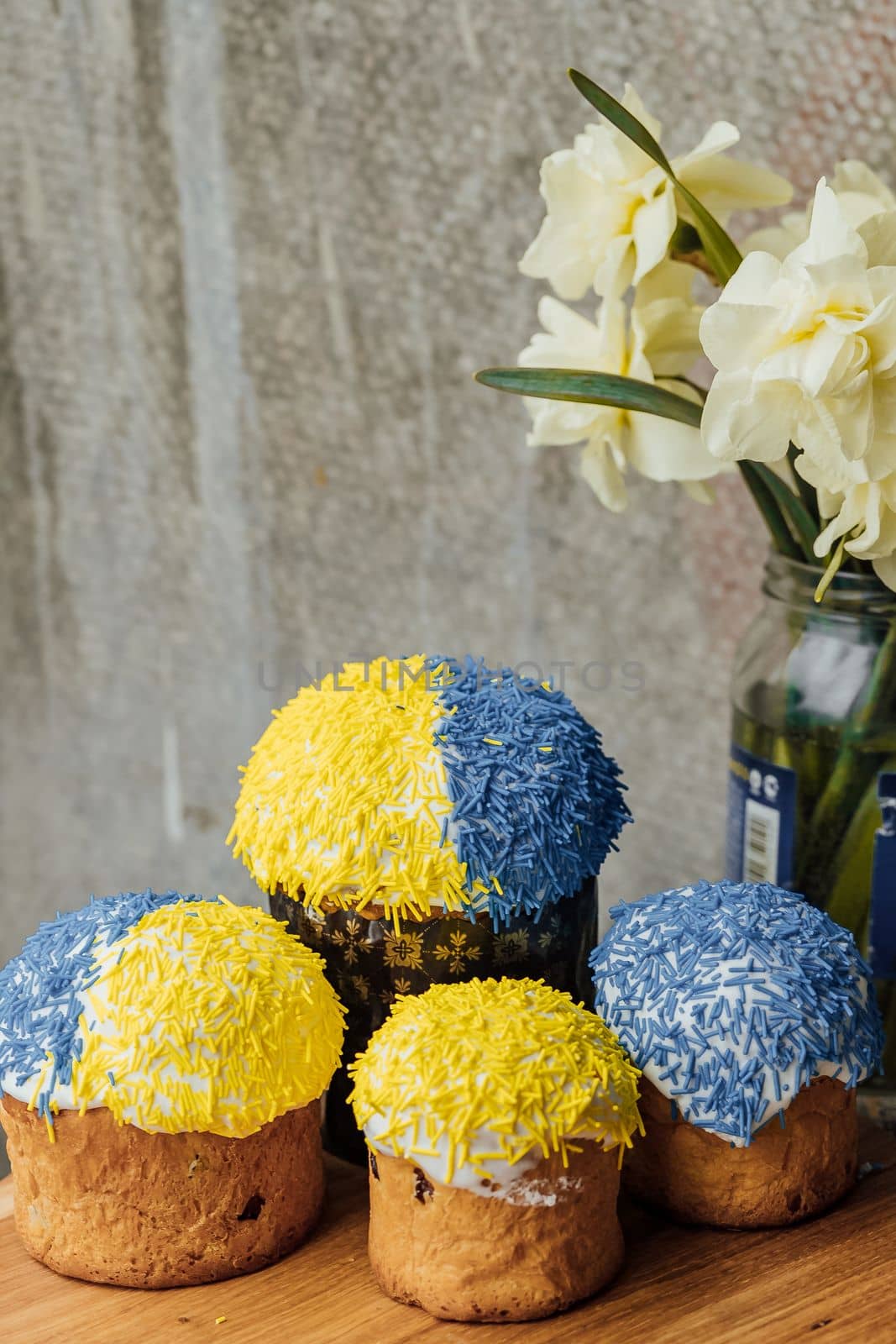 Delicious Easter cake and ingredients on wooden table.