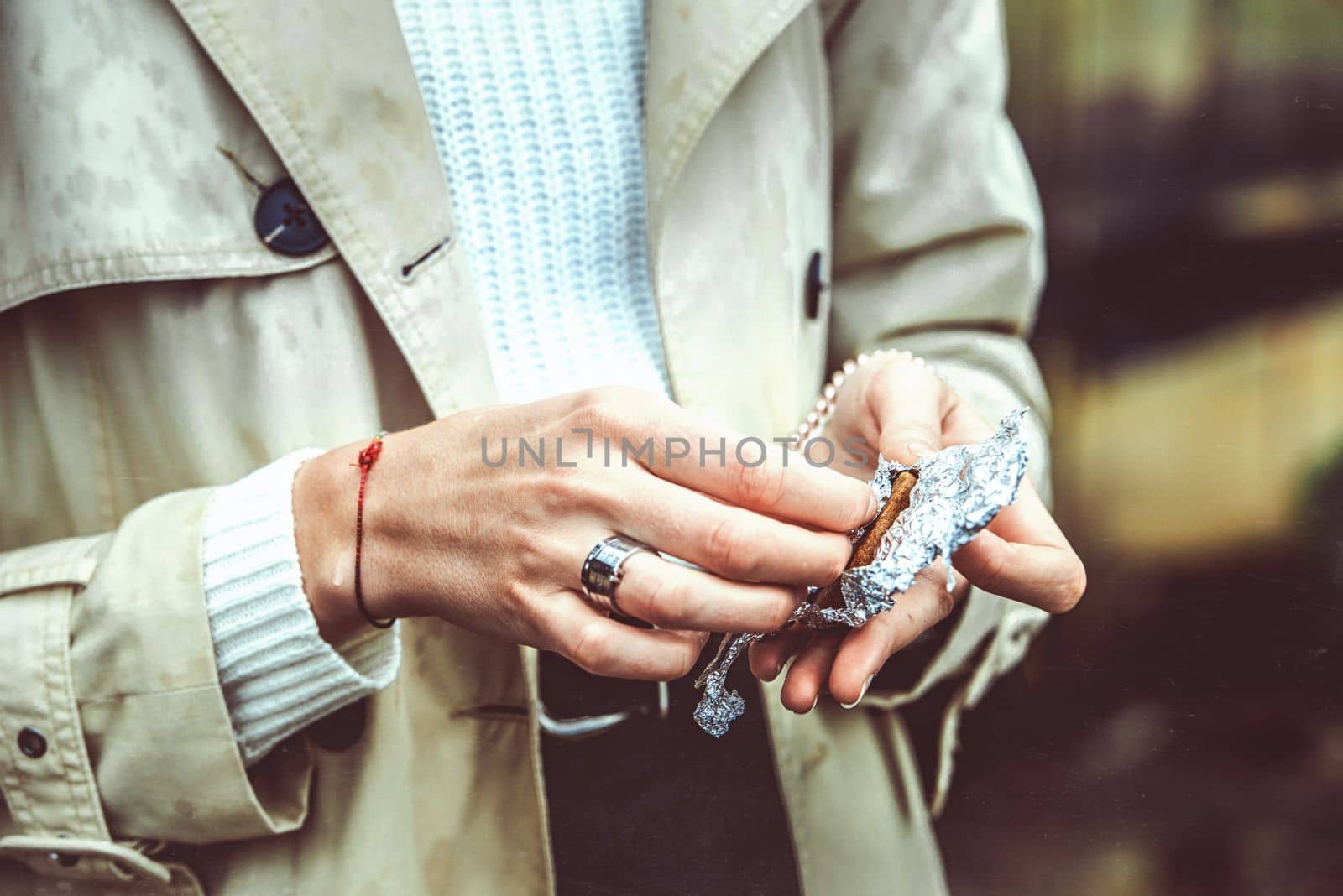 woman eating cookies made with cannabis cake medicinal edibles drug. selective focus. grain by Ashtray25