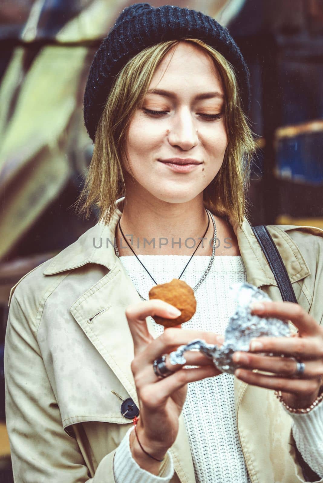 woman eating cookies made with cannabis cake medicinal edibles drug. selective focus. grain by Ashtray25