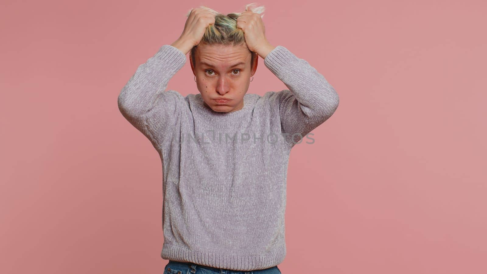 Upset scared frightened woman feeling worried nervous about serious troubles, stress and anxiety disorder, panic attack guilty. Girl on studio pink background. Lgbt gay lesbian people