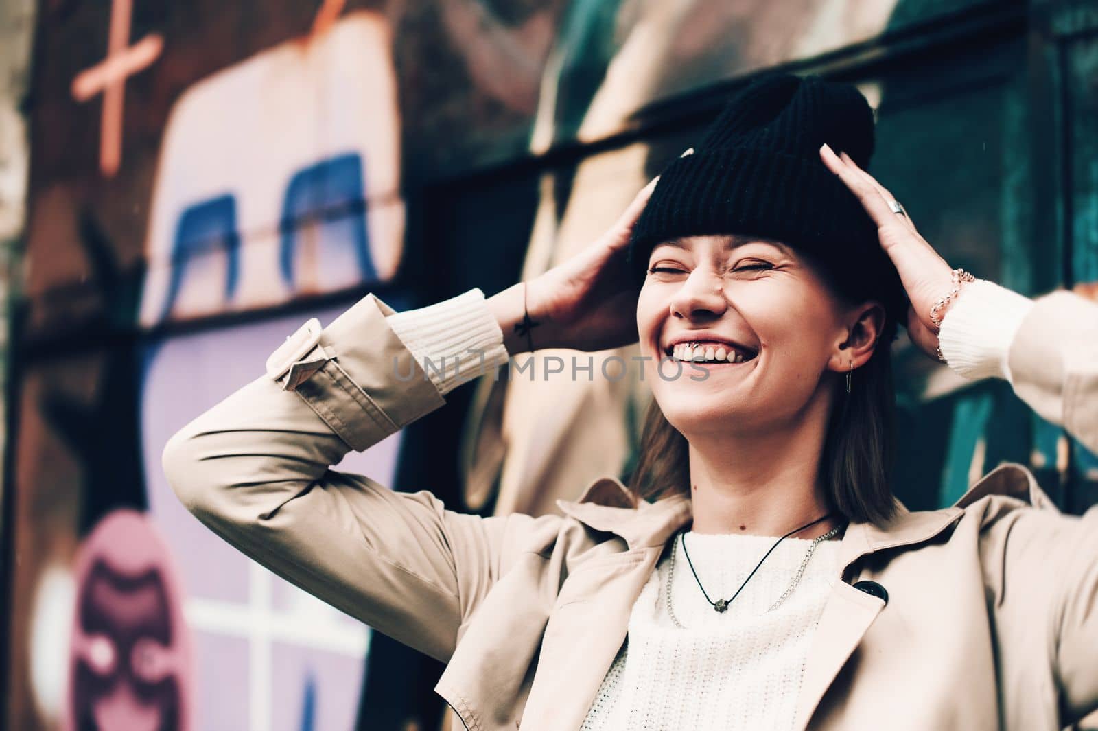 Close-up portrait Beautiful elegant woman wearing beige coat and black hat. Trendy casual outfit. Soft selective focus. grain by Ashtray25