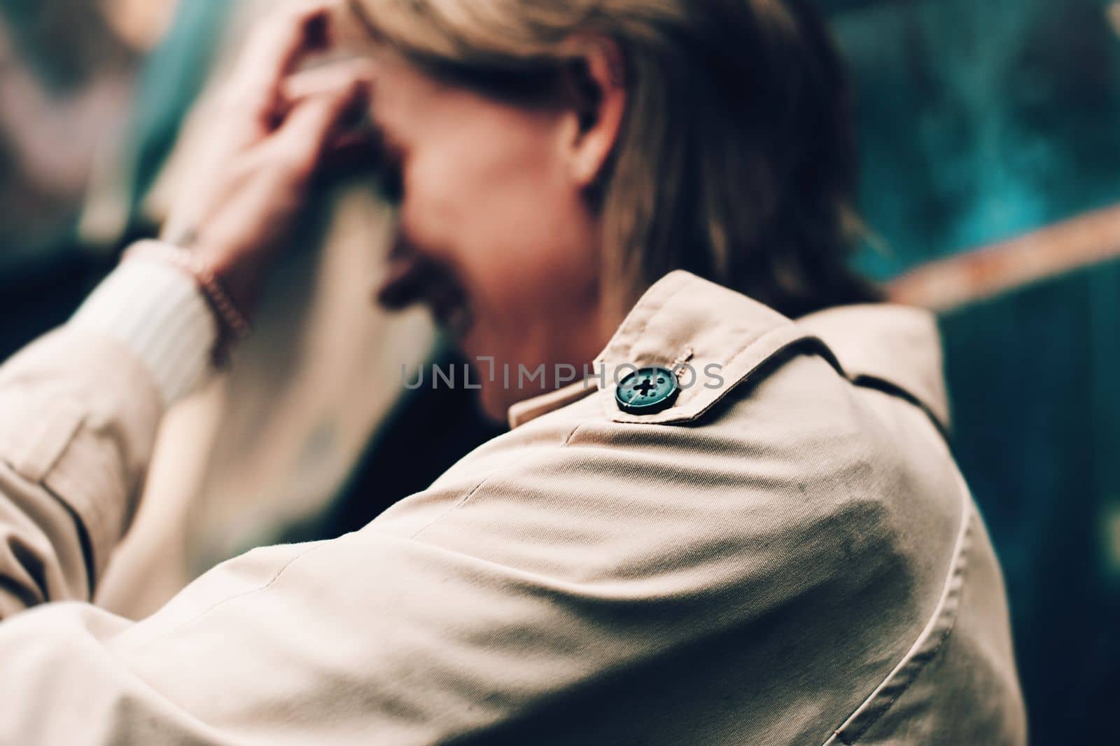 Close-up portrait Beautiful elegant woman wearing beige coat and black hat. Trendy casual outfit. Soft selective focus. grain.