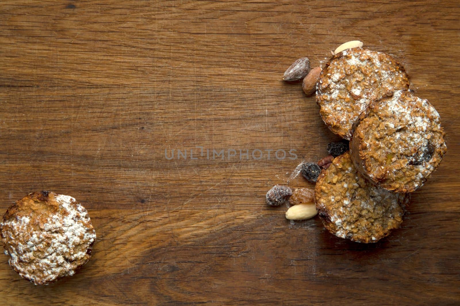 Freshly baked banana muffins top view on wooden background with copy space, healthy vegan cupcakes, diet vegetarian concept top view