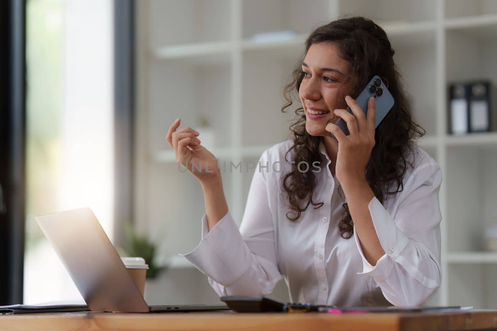 Business woman talking phone at office space. real estate, lawyer, non-profit, marketing by itchaznong