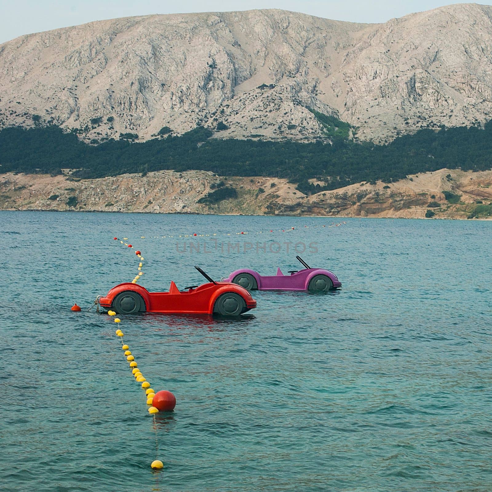 Water games on the beach in Baska