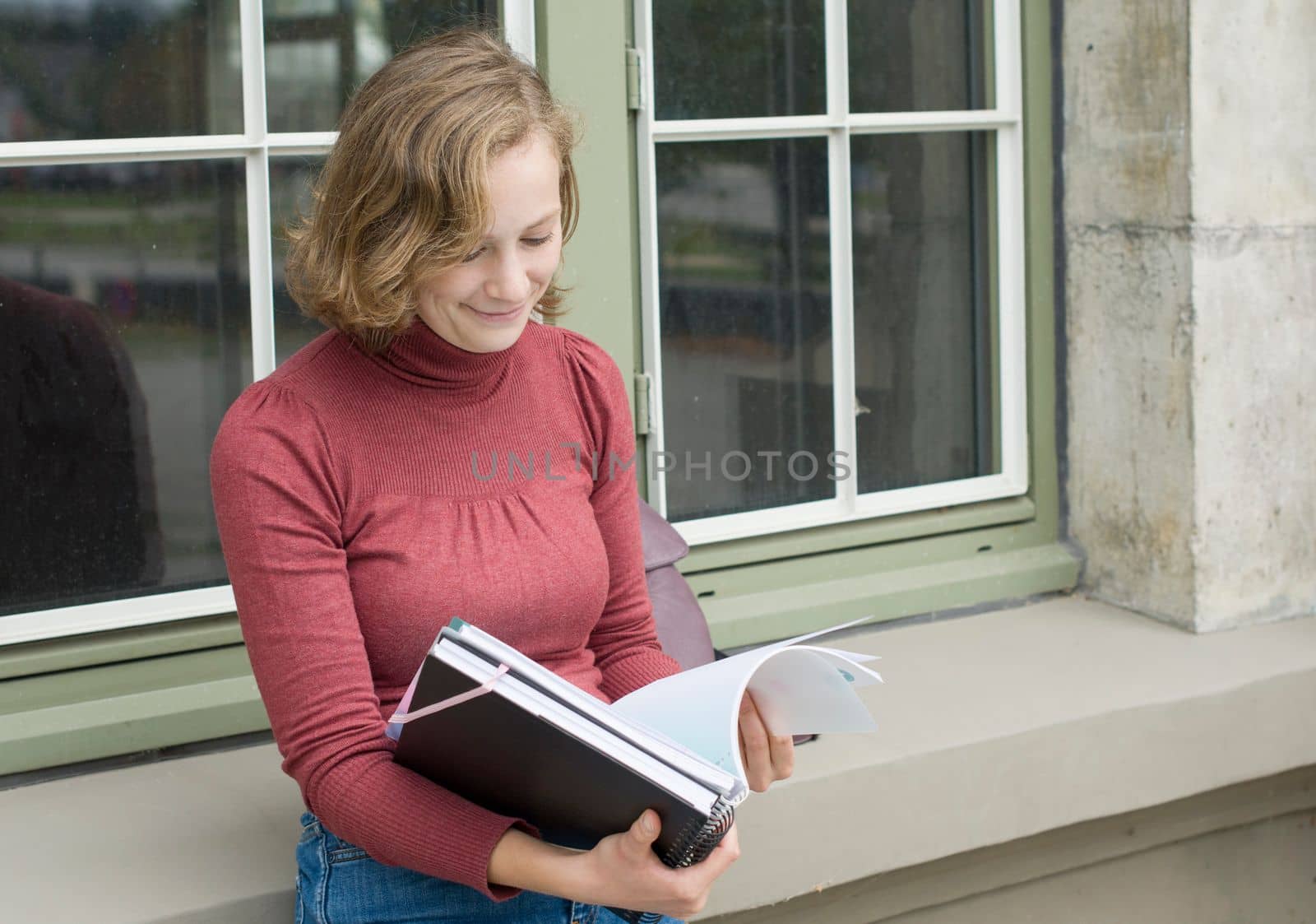 young caucasian girl going back to college, standing with a backpack and notebooks and smiling, back to school, High quality photo