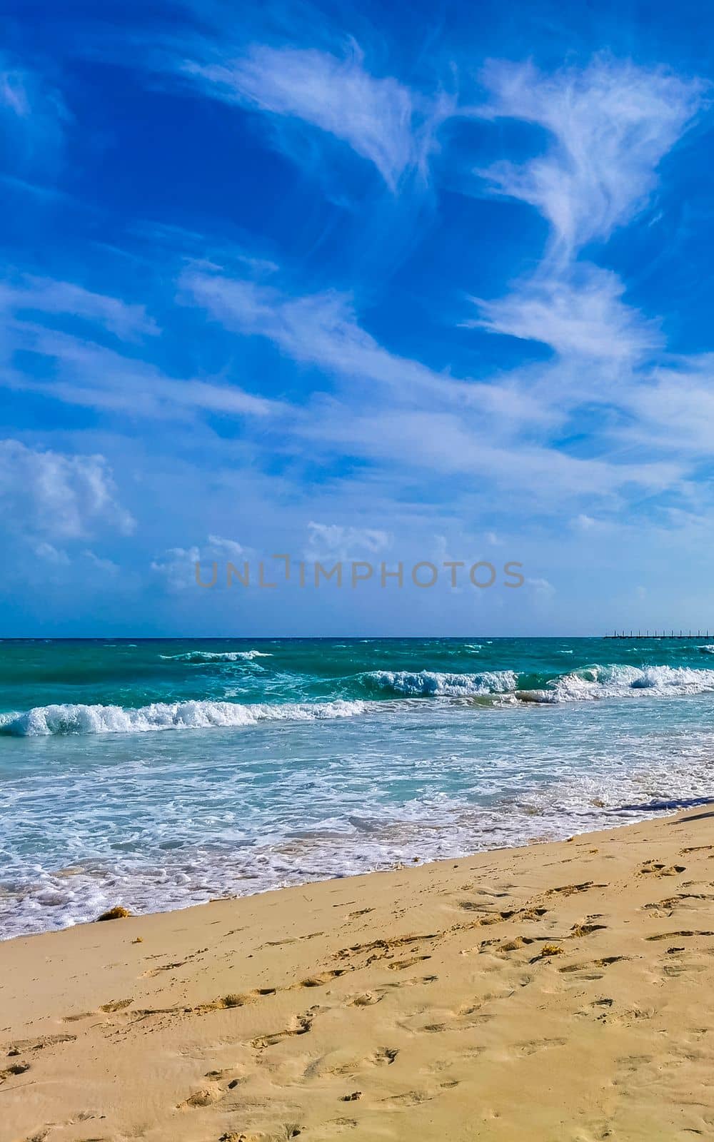 Tropical caribbean beach landscape panorama with clear turquoise blue water in Playa del Carmen Mexico.