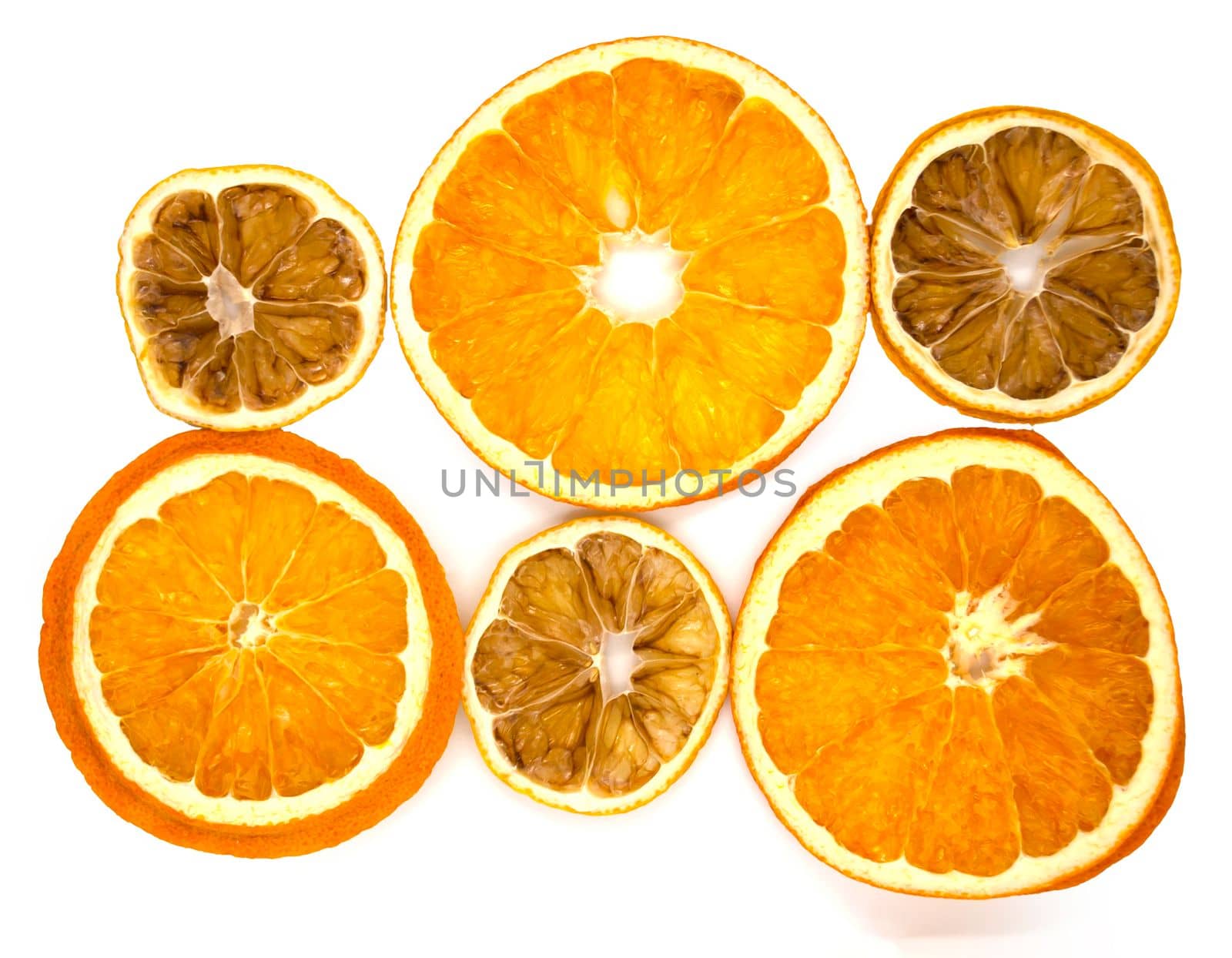 Dried orange and lemon slices. Dried orange and lemon slices on a white background, close-up.