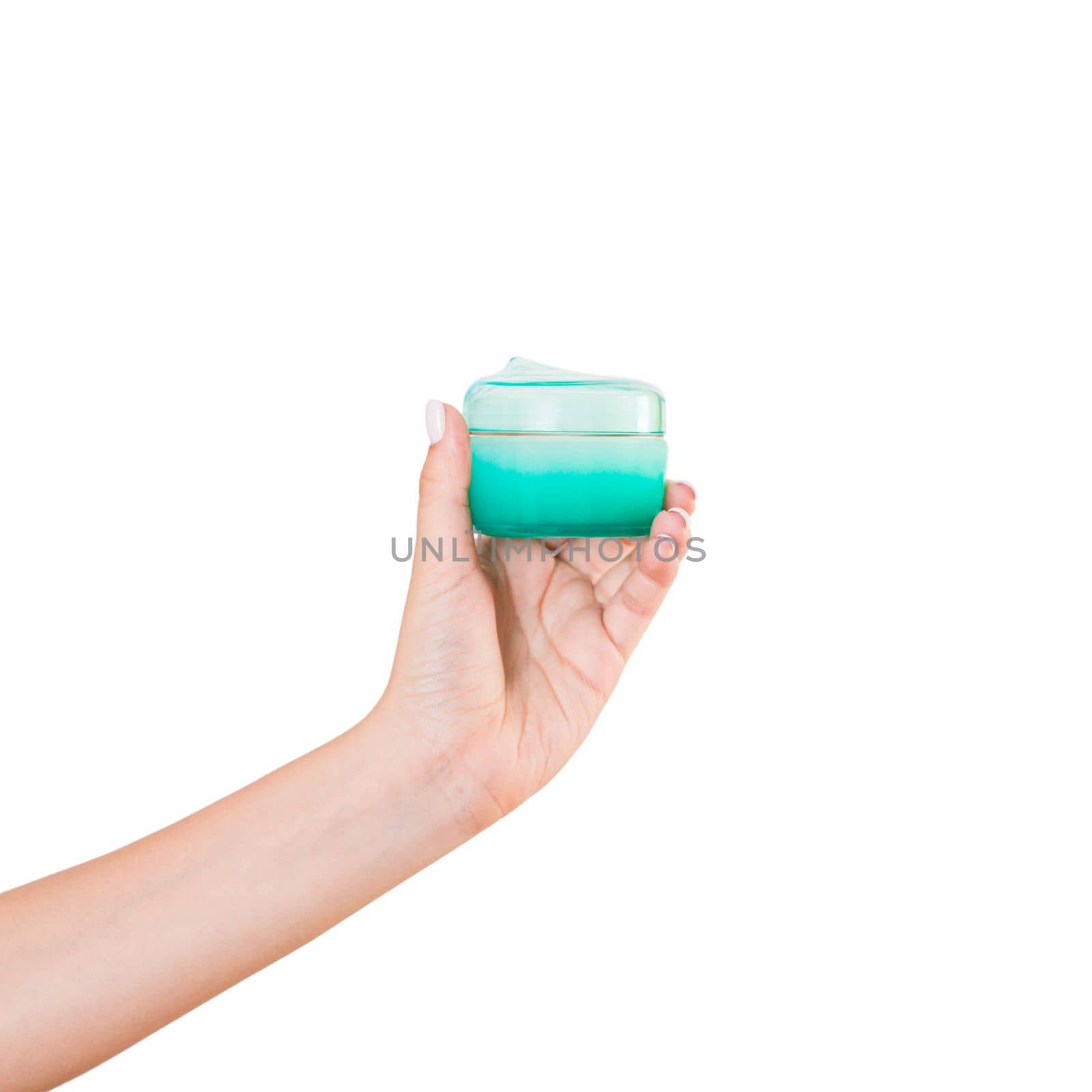 Female hand holding cream bottle of lotion isolated. Girl give cosmetic products on white background.