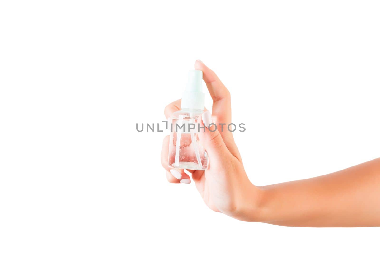 Female hand holding cream bottle of lotion isolated. Girl give tube cosmetic products on white background.