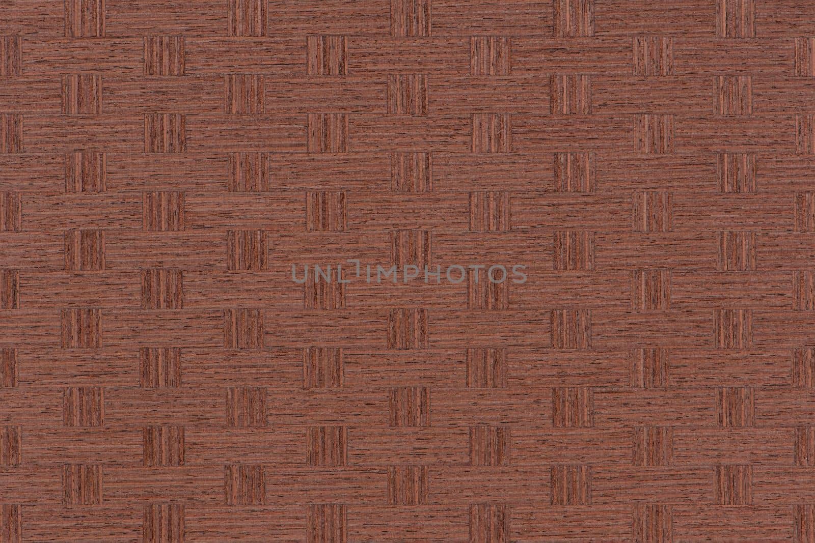 Texture of mahogany. Bright texture of mahogany veneer for furniture production. The veneer is glued with squares according to the pattern.