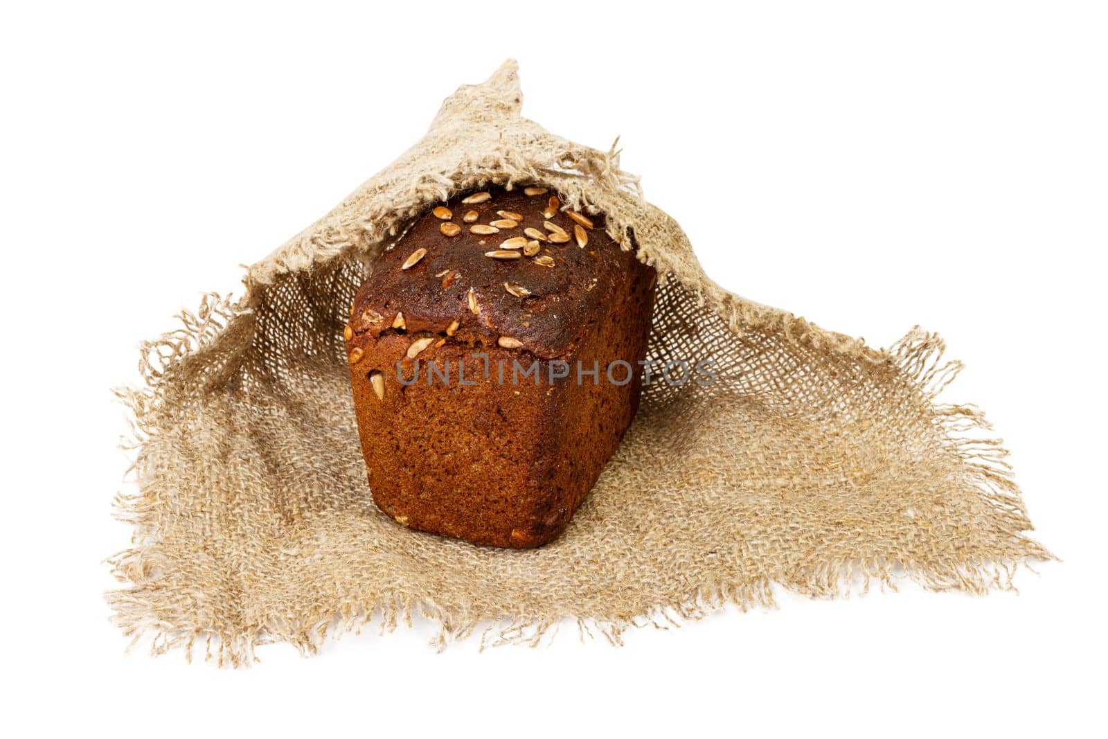 Fresh bread in cloth, isolated on white.