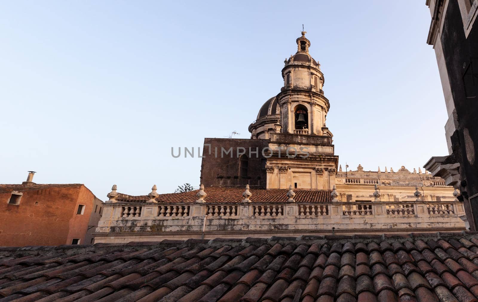 Top view of St. Agata church of Catania from the Badia church at sunset